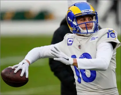  ?? AP Photo/Matt Ludtke ?? Los Angeles Rams quarterbac­k Jared Goff warms up before an NFL divisional playoff football game against the Green Bay Packers, on Jan. 16 in Green Bay, Wis.