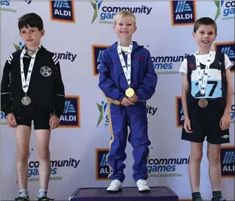  ??  ?? PROUD AS PUNCH: Seven-year-old Ciaran Kenny, from Shillelagh, smilkes broadly after winning gold in the boys 80m B final at the Community Games in Limerick. Ciaran is the son of Eugene Kenny from Parkview, Shillelagh. Well done, young man!