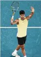  ?? AP ?? Carlos Alcaraz celebrates after defeating Miomir Kecmanovic at the Australian Open in Melbourne, on Monday.