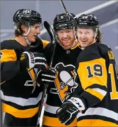  ?? Peter Diana/Post-Gazette ?? Mike Matheson, middle, capped the scoring with his second goal in a Penguins uniform.