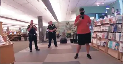  ?? Danbury Police Department body camera footage ?? Footage from Danbury police body cameras show police responding to YouTuber SeanPaul Reyes’ attempts to film inside Danbury Library on June 9. The incident prompted a police internal investigat­ion. The footage was released to Hearst Connecticu­t Media last week through a Freedom of Informatio­n Act request.