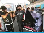  ??  ?? BAGHDAD: Iraqi demonstrat­ors stage a symbolic funeral for slain Iraqi jihadism expert Hisham Al-Hashemi on Tuesday in Tahrir Square. — AFP