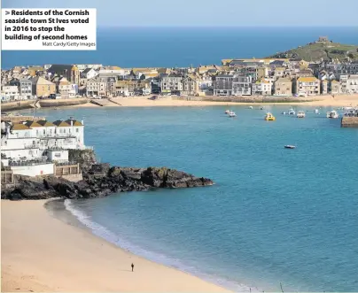  ?? Matt Cardy/Getty Images ?? Residents of the Cornish seaside town St Ives voted in 2016 to stop the building of second homes