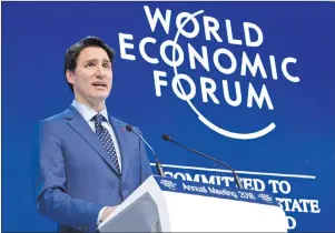  ?? CP PHOTO ?? Prime Minister Justin Trudeau addresses the World Economic Forum Tuesday in Davos, Switzerlan­d. Trudeau says Canada and 10 other countries of the Trans-Pacific Partnershi­p have agreed to a revised trade agreement.