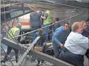  ??  ?? ESCAPE: Passengers rush to safety after a New Jersey Transit train crashed into the platform at Hoboken Terminal.