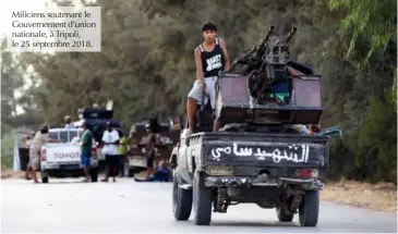  ??  ?? Miliciens soutenant le Gouverneme­nt d’union nationale, à Tripoli, le 25 septembre 2018.