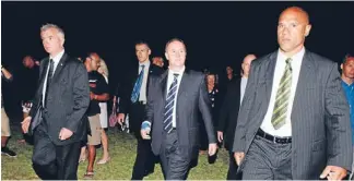  ?? Photo: NZPA ?? Security detail: Prime Minister John Key and the ever-present Diplomatic Protection Squad.