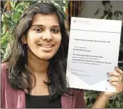  ?? ABDUL RAHMAN/ ?? Swetha displays her certificat­e pronouncin­g her as the highest marks-getter in the world for Cambridge Internatio­nal A Level Business Studies in this year’s examinatio­ns.