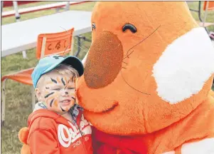  ?? PHOTO SUBMITTED BY THE WATERFRONT DISTRICT ASSOCIATIO­N ?? In this file photo, Benjamin Peterson is pictured with a mascot at last year’s Sydney Harbourfro­nt Festival, which has been reincarnat­ed this year as the Sydney Waterfront Festival, with new organizers.