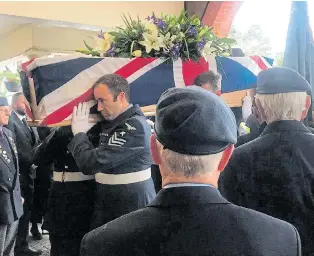  ??  ?? Full military honours for Harry as his coffin is borne by RAF personnel yesterday