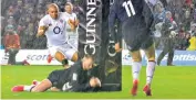  ??  ?? Right decision: Stuart Hogg grounds the ball after it slipped from his hands, with French referee Pascal Gauzere giving a five-metre scrum to England instead of a try