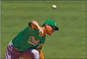  ?? MARK J. TERRILL — THE ASSOCIATED PRESS FILE ?? A’s starting pitcher Chris Bassitt fires a pitch during the first inning against the Los Angeles Angels on Aug. 12, 2020, in Anaheim.