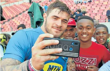  ?? Picture: BRIAN WITBOOI ?? MARX MAN: Fiery Lions and Springbok hooker Malcolm Marx takes a selfie with excited Tyrique Zimdahl, 16, and other young fans during a meet-and-greet session at the Nelson Mandela Bay Stadium in Port Elizabeth on Monday