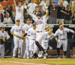  ?? Nati Harnik / Associated Press ?? Mississipp­i State second baseman Hunter Stovall celebrates as he scores the winning run against Washington.