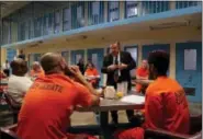  ?? JULIE JACOBSON — THE ASSOCIATED PRESS ?? Soldier On president John Downing talks with inmates inside the veteran’s pod at the Albany County Correction­al Facility on Monday, Nov. 27, 2017, in Albany, N.Y.