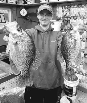  ?? PROVIDED ?? Kyle Tepper holds his 3 ½-pound crappie, caught this month in the Chain O’Lakes area, next to a 17-inch crappie for comparison.