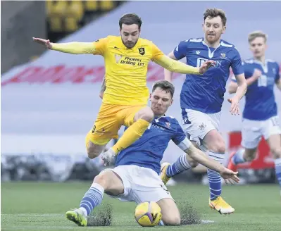  ??  ?? Captain fantastic Jason Kerr challenges Scott Pittman to halt a Livingston attack