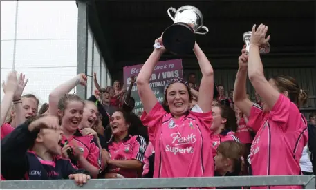  ??  ?? Delight for the Clonard/Volunteers contingent as jubilant captain Aoife Tormey raises the cup aloft.