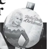  ?? [BUTTERFLY RECORDS/VIA AP] ?? BELOW: Dolly Parton has a new CBS special, “A Holly Dolly Christmas” (Dec. 6, 7:30 p.m. CST). She released “A Holly Dolly Christmas” earlier this year.