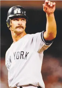  ?? ?? The New York Yankees’ Don Mattingly acknowledg­es the crowd’s standing ovation at first base after getting his 2,000 career hit in the seventh inning against the California Angels at Anaheim Stadium on July