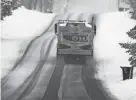  ?? CHARLES KRUPA/AP ?? A home heating oil delivery truck climbs a snow covered road, Feb. 28, 2023, in Derry, N.H. Americans who struggled because of inflation may get a break on heating costs this winter.