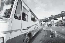 ?? Elaine Thompson / Associated Press ?? An RV driver heads into the U.S. from Canada on Nov. 8 in Blaine, Wash. New rules will allow fully vaccinated foreign nationals to enter the U.S. for any reason.