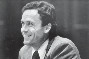  ?? THE ASSOCIATED PRESS ?? In this file photo, Ted Bundy smiles during the second day of jury selection for his murder trial in a Dade County courtroom in Miami, Fla.