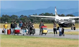  ??  ?? Air services ferried stranded passengers across the Rangitata.