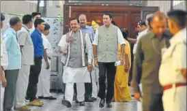  ?? HTPHOTO ?? Deputy CM Keshav Prasad Maurya and BJP MLA Sangeet Som walking through the corridors of Vidhan Bhawan on Wednesday.
