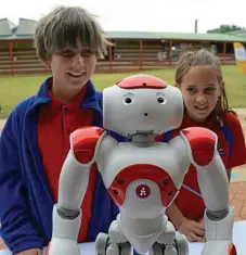  ??  ?? Vale View State School’s Coby Smith and Bridget Pohlman with their robot at the launch of the Mayor’s Telstra Technology Awards.