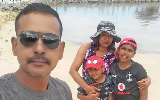  ?? ?? Republic of Fiji Military Forces (RFMF) Major Praneel Singh with his family.