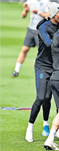  ??  ?? Team spirit: Danny Rose (right) looks happy during England training