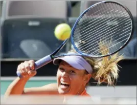  ?? ANDREW MEDICHINI — THE ASSOCIATED PRESS ?? Maria Sharapova returns the ball to Christina Mchale during the Italian Open. French Open officials chose not to award Sharapova a wild-card due to her 15-month doping ban.