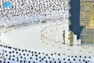  ?? REUTERS ?? Pilgrims perform the Fajr prayer without social distancing, after Saudi authoritie­s announced the easing of COVID-19 restrictio­ns, at the Grand Mosque in the holy city of Mecca yesterday.