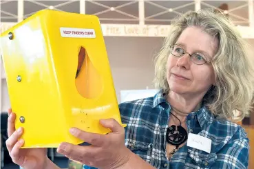  ?? PHOTO: GREGOR RICHARDSON ?? Goodbye possums . . . Otago Peninsula Biodiversi­ty Group project manager Dr Ursula Ellenberg holds one of the hundreds of Timms traps the trust uses to trap and kill possums on the Otago Peninsula.