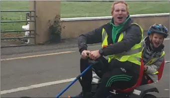  ??  ?? Ross Donovan and his son Michael completed 10km in a go-kart towards the Eastern Harps fundraiser.