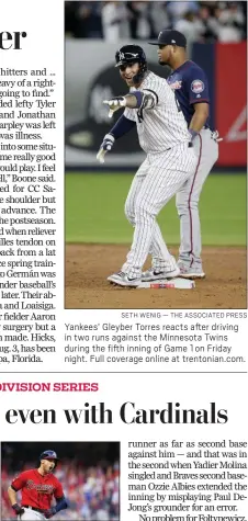  ?? SETH WENIG — THE ASSOCIATED PRESS ?? Yankees’ Gleyber Torres reacts after driving in two runs against the Minnesota Twins during the fifth inning of Game 1 on Friday night. Full coverage online at trentonian.com.