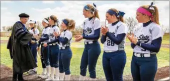  ??  ?? When Penn State Brandywine’s April 10 academic recognitio­n ceremony was on the same day as a home softball doublehead­er, Chancellor Kristin Woolever stopped by the field before the games started to present awards to seven players who earned academic...