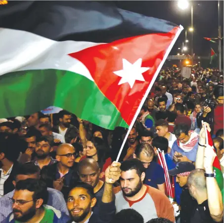  ?? (Reuters) ?? A JORDANIAN attends a protest against annexation.