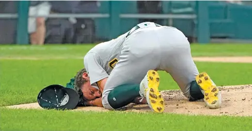  ?? AP ?? A’s pitcher Chris Bassitt was hit in the face by a line drive Tuesday against the Sox. He suffered a fractured cheekbone and two facial cuts, but his vision is normal.