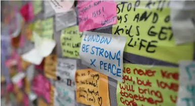  ?? (Marko Djurica/Reuters) ?? MESSAGES OF SUPPORT are seen on London Bridge on Thursday.