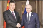  ?? AP PHOTO ?? China’s President Xi Jinping, left, poses with Russia’s President Vladimir Putin for a photo at the BRICS summit in Johannesbu­rg, South Africa, earlier this year.