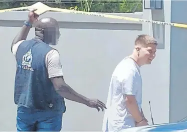  ?? | SUPPLIED ?? ALLEGED drug dealer Callum Gower, right, is arrested after fleeing his home in the UK.
