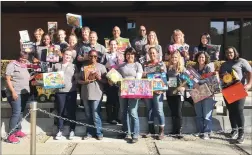  ??  ?? Cal Water employees donate toys to help brighten the holidays for local low-income families.