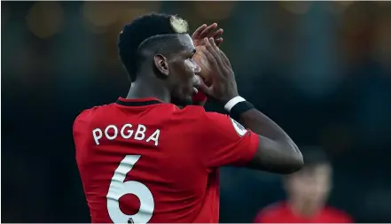  ?? GETTY IMAGES ?? Manchester United midfielder Paul Pogba salutes the fans last Monday.