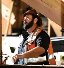  ?? AP PHOTO ?? A constructi­on worker looks up at the I-10 freeway in Los Angeles, which was closed by fire on Nov. 19, 2023. The latest data showed that a surprising 275,000 jobs were added in February, demonstrat­ing the resilience of the US economy.