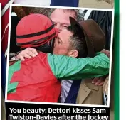  ?? DAVID HARTLEY/BPI ?? You beauty: Dettori kisses Sam Twiston-Davies after the jockey steered Dodging Bullets to victory in the Queen Mother Champion Chase