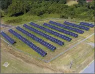  ?? (Arkansas Democrat-Gazette/Staton Breidentha­l) ?? This aerial photo shows the Pulaski County solar array on South Brown Street in Little Rock.