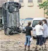  ?? PHOTO: GETTY ?? Damage: A car stands on its end after being washed away by flood in Hitoyoshi, Kumamoto Prefecture, Japan.