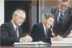  ??  ?? 0 Then Soviet leader Mikhail Gorbachev and US president Ronald Reagan sign the pact on US and Soviet nuclear missiles in 1987